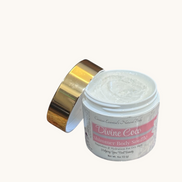 Creation Essential's Natural Body Divine Coco Shimmer Body Soufflé in a jar with a gold lid on a blue background