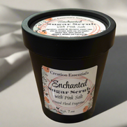 Container of Enchanted Sugar Scrub with Pink Salt on a light background
