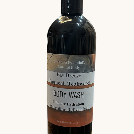 Creation Essential's Natural Body Bay Breeze Tropical Teakwood organic body wash in a 16oz black bottle