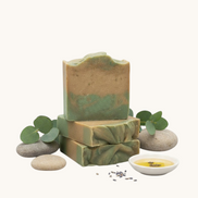 Creation Essential's Natural Body cucumber and melon soap bar with shea butter and aloe vera on a spa-inspired display