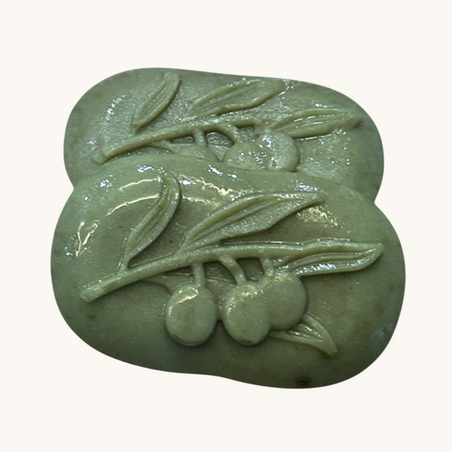 Creation Essential's Natural Body Cucumber Fresh soap bars with embossed olive branch design in light green