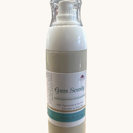 Creation Essential's Natural Body Green Serenity facial cream in a pump bottle with green tea and cucumber extracts.