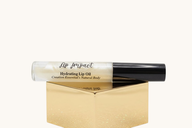 Lip impact hydrating lip oil with black cap on a white background