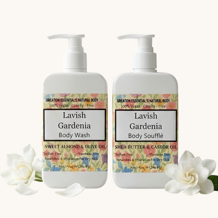 Creation Essential's Natural Body Lavish Gardenia body wash and souffle set with floral labels on a marble surface.