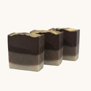Creation Essential's Natural Body Frankincense and Myrrh honey bar soap with a layered brown design and gold top