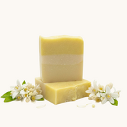 Creation Essential's Natural Body citrus bar soap with raw honey and aloe vera, featuring fresh lemon scent.