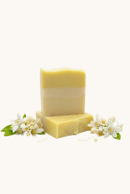 Creation Essential's Natural Body citrus bar soap with raw honey and aloe vera, featuring fresh lemon scent.