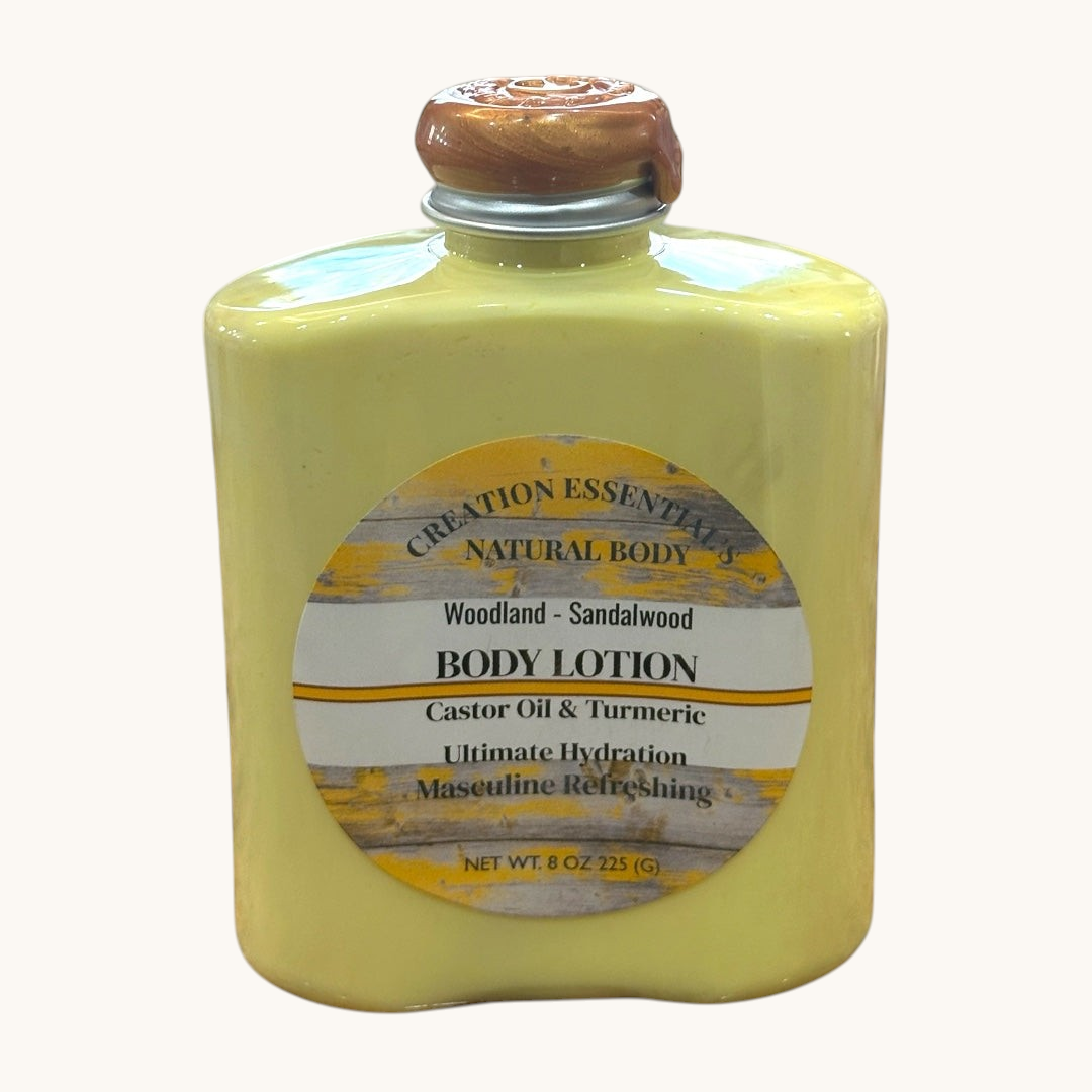 Creation Essential's Natural Body Woodland Sandalwood nourishing men's body lotion in a yellow 8oz bottle