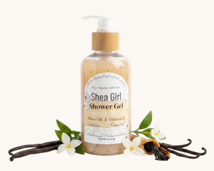 Shea Girl Shower Gel bottle on a wooden surface with a white background