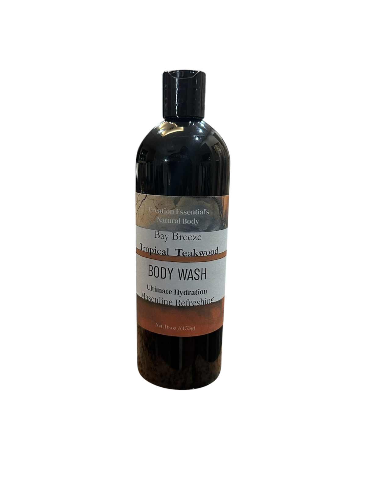 Creation Essential's Natural Body Bay Breeze Tropical Teakwood body wash in a black bottle on a white pedestal