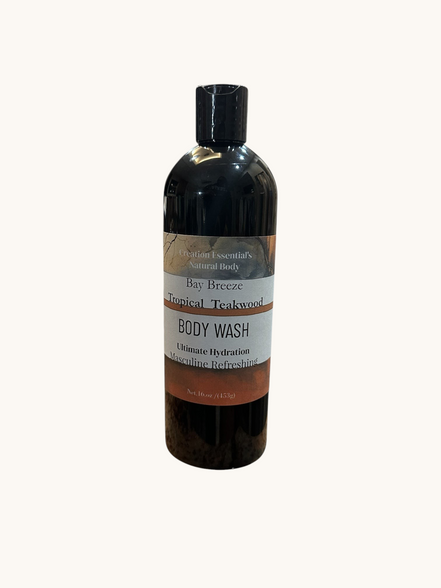 Creation Essential's Natural Body Bay Breeze Tropical Teakwood organic body wash in a 16oz black bottle.