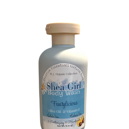 Creation Essential's Natural Body Shea Girl Fruitylicious body wash in a light blue bottle on a wooden tray