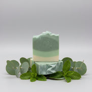 Stack of green and white striped soap bars 
