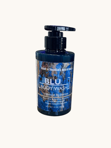 Creation Essential's Natural Body BLU organic masculine body wash in a 12oz pump bottle on a wooden surface