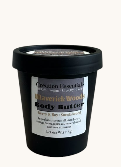 Creation Essential's Natural Body Maverick Woods body butter in a black 4oz jar with berry, bay, and sandalwood scent.