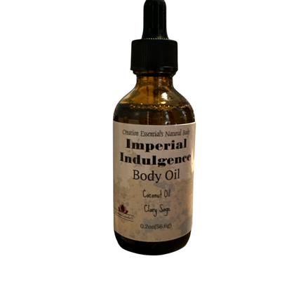 Creation Essential's Natural Body Imperial Indulgence body oil bottle with coconut oil and clary sage on a wooden shelf