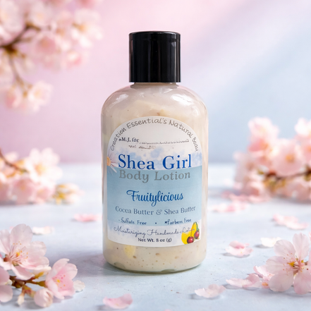 Shea Girl body lotion bottle with cherry blossoms in the background