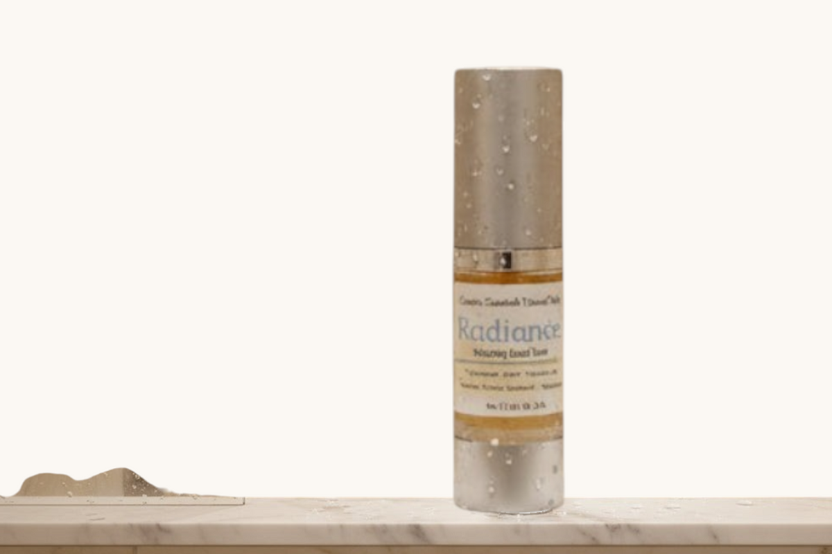 Creation Essential's Natural Body Radiance Hyaluronic Facial Toner bottle on a marble ledge in a steamy shower.
