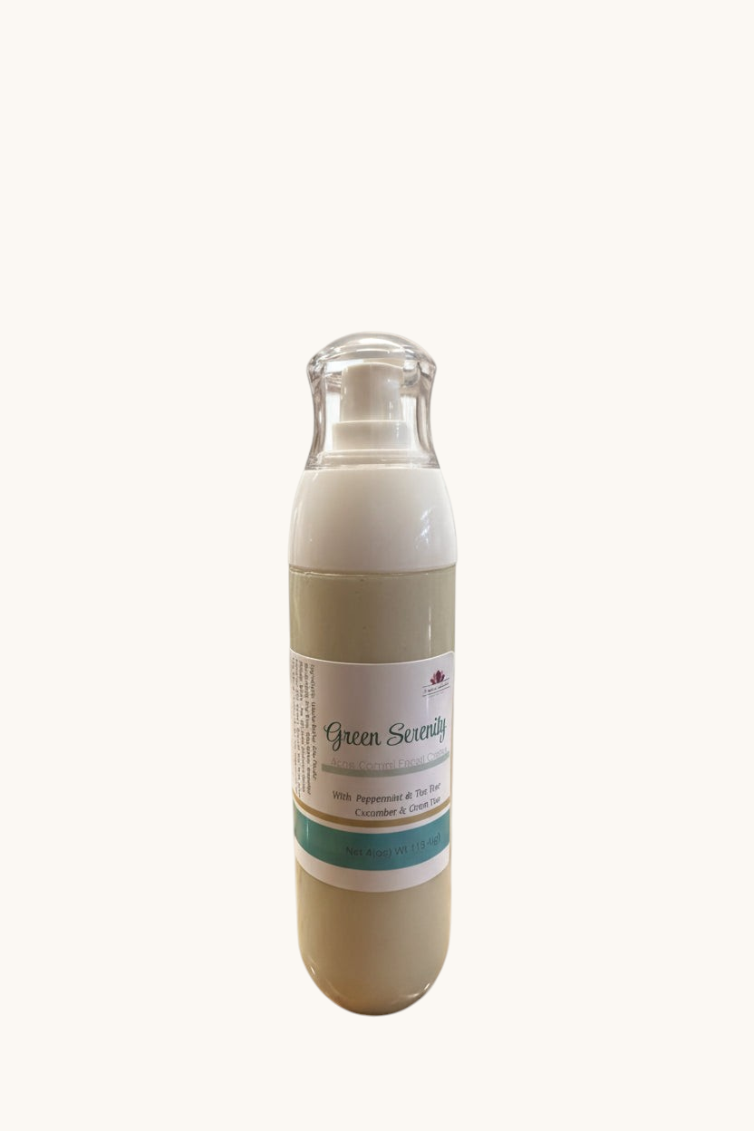 A bottle of Green Serenity facial cream with green tea and cucumber, displayed against a white brick background.