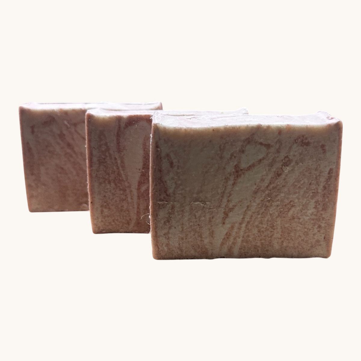 Creation Essential's Natural Body Himalayan Bliss salt bar soap with a marbled pink texture for gentle exfoliation.