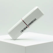 White rectangular product with 'Creation Essentials' branding on a light gray background