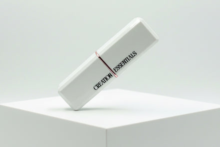 White rectangular product with 'Creation Essentials' branding on a light gray background