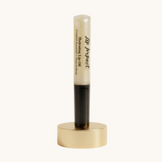 Lip balm with black cap and visible brand name on a white background
