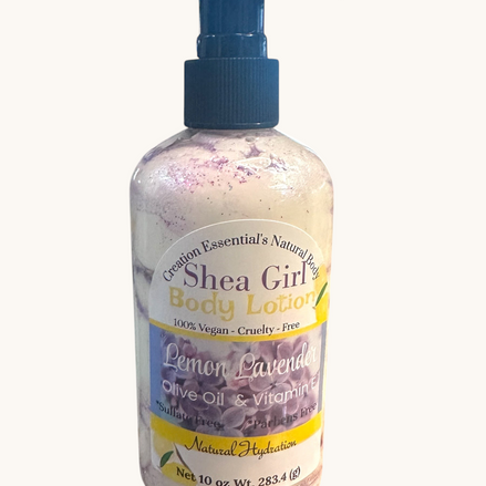 Creation Essential's Natural Body Shea Girl Lemon Lavender body lotion in a pump bottle on a brown towel outdoors.