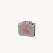 Creation Essential's Natural Body Honey Harvest sunflower and apple soap bar with dried flower petals on top
