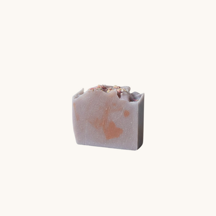 Creation Essential's Natural Body Honey Harvest sunflower and apple soap bar with dried flower petals on top