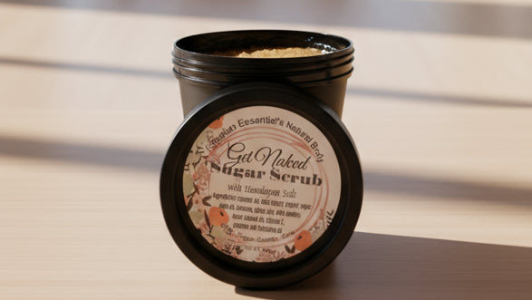 Jar of sugar scrub with a label on a reflective surface