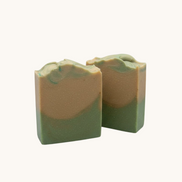 Creation Essential's Natural Body cucumber and melon hydration soap bars with green and tan layers on a white background