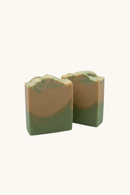 Creation Essential's Natural Body cucumber and melon hydration soap bars with green and tan layers on a white background