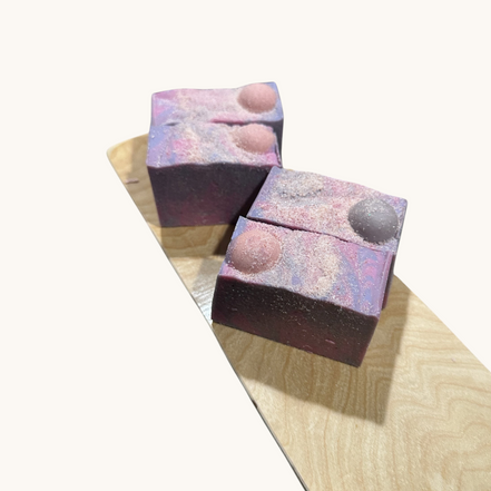Creation Essential's Natural Body Moon Light Salty Soap Bar with purple swirls and Himalayan salt on a wooden board