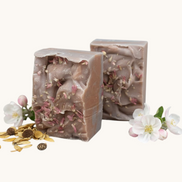 Creation Essential's Natural Body Honey Harvest soap bars topped with dried flowers and apple blossoms