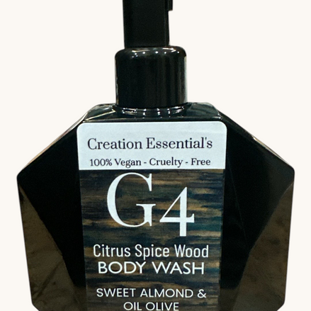 Creation Essential's Natural Body G4 body wash in a black geometric pump bottle with citrus spice wood fragrance