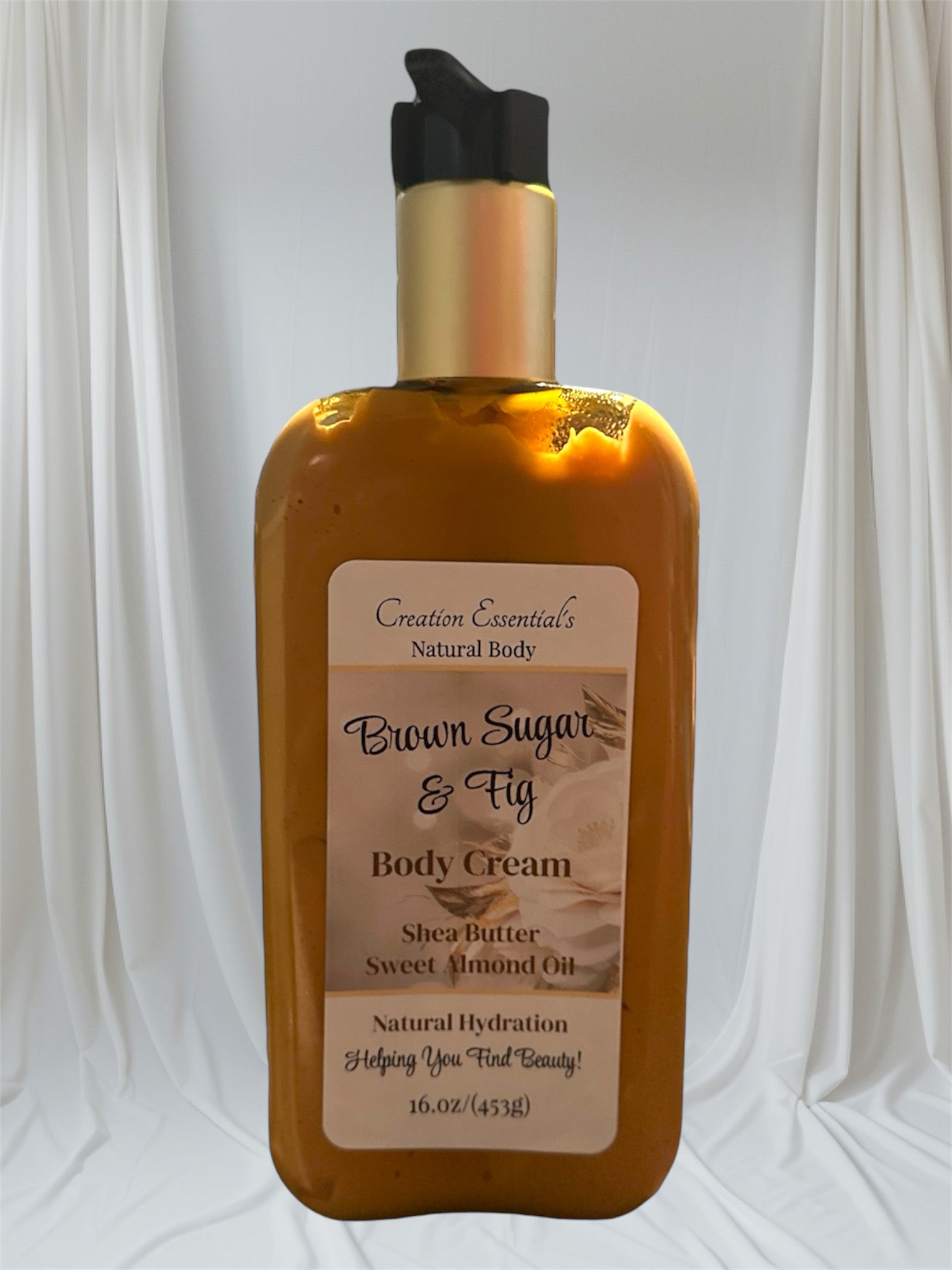 A pump bottle of Brown Sugar & Fig with Cashmere body lotion against a white background.