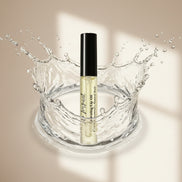 Cosmetic bottle with water splash on a beige background