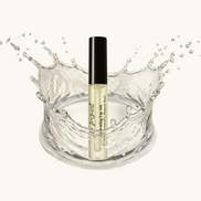 Cosmetic bottle with water splash on a beige background