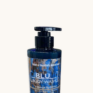 Creation Essential's Natural Body BLU organic masculine body wash in a 12oz pump bottle on a marble surface.