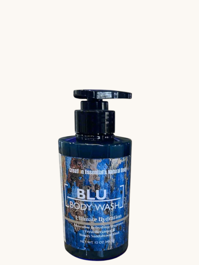 Creation Essential's Natural Body BLU organic masculine body wash in a 12oz pump bottle on a marble surface.