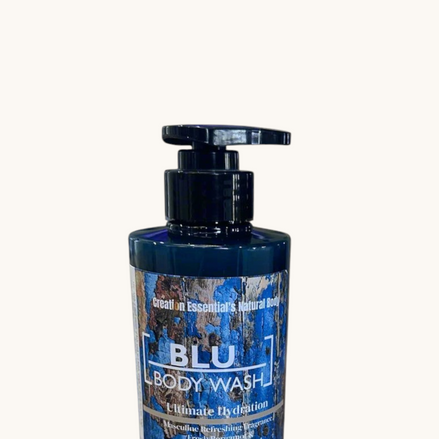 Creation Essential's Natural Body BLU organic masculine body wash in a 12oz pump bottle on a marble surface.