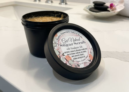 Jar of natural body scrub with visible contents and label.