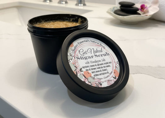 Jar of natural body scrub with visible contents and label.