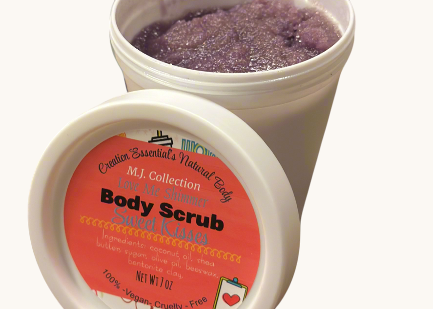 Creation Essential's Natural Body Sweet Kisses shimmer body scrub in a white jar with purple exfoliating sugar texture