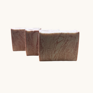 Creation Essential's Natural Body Himalayan Bliss salt bar soap with a textured, marbled pink and white surface.