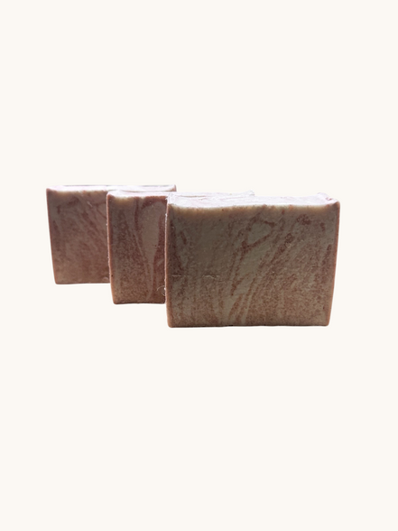 Creation Essential's Natural Body Himalayan Bliss salt bar soap with a textured, marbled pink and white surface.