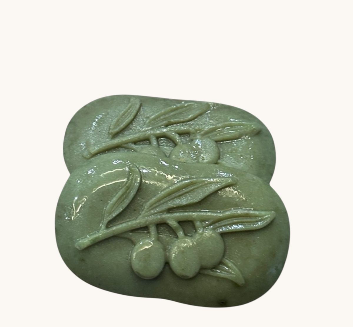 Creation Essential's Natural Body Cucumber Fresh soap bars with embossed olive branch design in light green