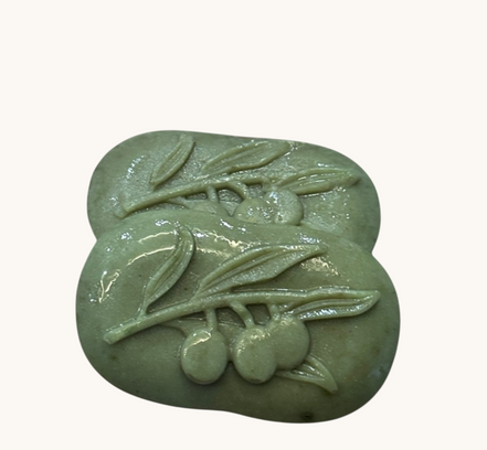 Creation Essential's Natural Body Cucumber Fresh soap bars with embossed olive branch design in light green