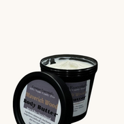 Body butter container with label on a marble countertop